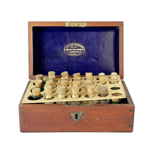 1 - An Ashton & Parsons homeopathic pharmacy box. The fitted interior with 27 glass bottles with cork st... 