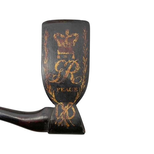 105 - A George III painted wood ceremonial axe. Painted with GR III monogram and the word 'Peace' beneath ... 