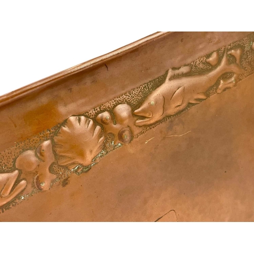 106 - A Newlyn copper rectangular tray. Repousse decorated with a border of fish, scallops and whelks, app... 