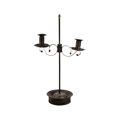 117 - A painted tin and wrought iron adjustable candelabrum. 19th century, with a brass acorn finial, on a... 