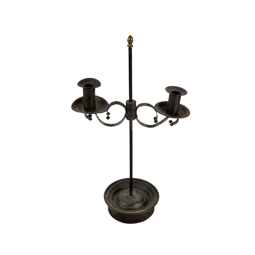 117 - A painted tin and wrought iron adjustable candelabrum. 19th century, with a brass acorn finial, on a... 