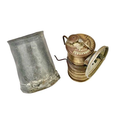 157 - A Victorian Dartmoor Prison Officer's pewter mess mug. With engraved crest, height 10cm, together wi... 