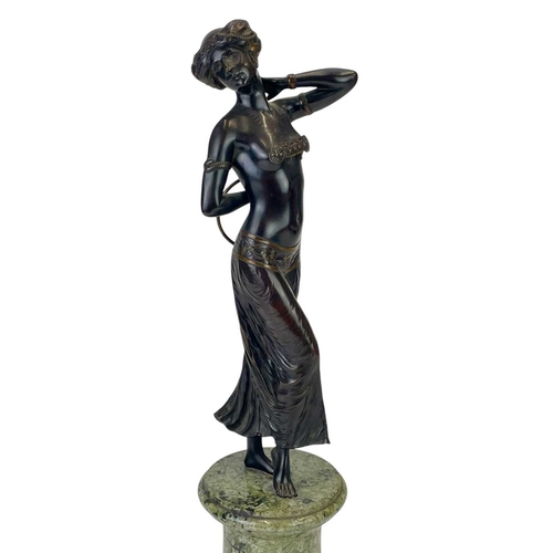 17 - Attributed to Gotthilf Jaeger (1871-1933) An Art Deco bronze figure of a dancer with a hoop, on a gr... 