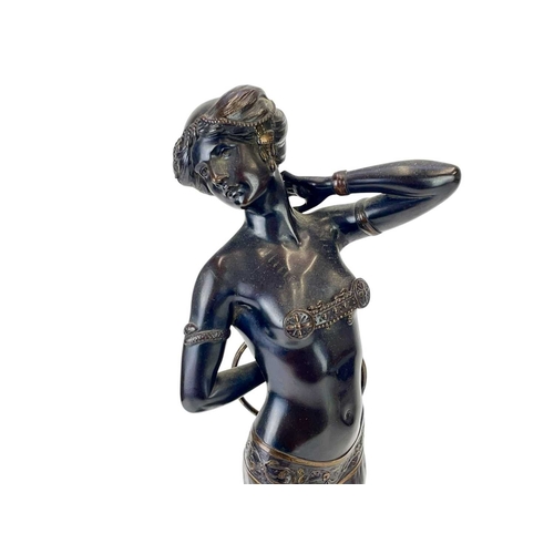 17 - Attributed to Gotthilf Jaeger (1871-1933) An Art Deco bronze figure of a dancer with a hoop, on a gr... 