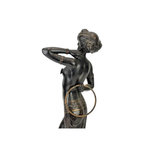 17 - Attributed to Gotthilf Jaeger (1871-1933) An Art Deco bronze figure of a dancer with a hoop, on a gr... 