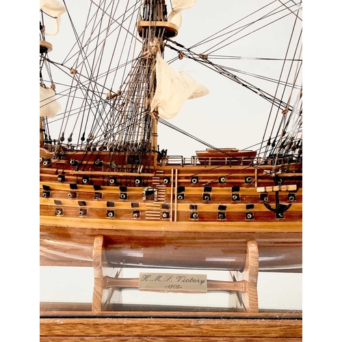 2 - A wood model of HMS Victory. Along with a similar sectional model, in a glazed case. Height 54cm, wi... 