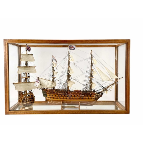 2 - A wood model of HMS Victory. Along with a similar sectional model, in a glazed case. Height 54cm, wi... 