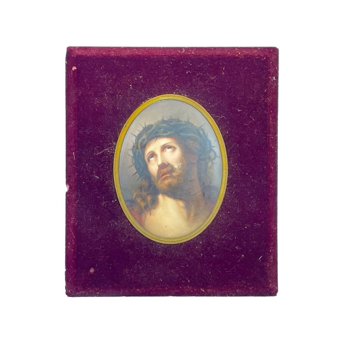 232 - A German porcelain oval painted plaque. Late 19th century, painted Christ with a crown of thorns, 16... 