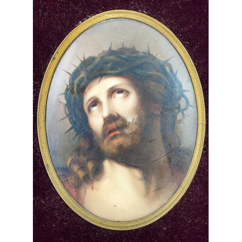 232 - A German porcelain oval painted plaque. Late 19th century, painted Christ with a crown of thorns, 16... 