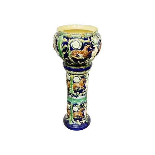 236 - A pair of continental majolica jardinieres and stands. Circa 1870, decorated with stylised beasts, f... 