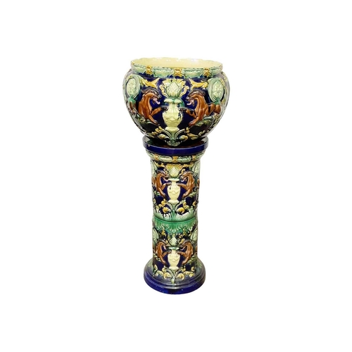 236 - A pair of continental majolica jardinieres and stands. Circa 1870, decorated with stylised beasts, f... 