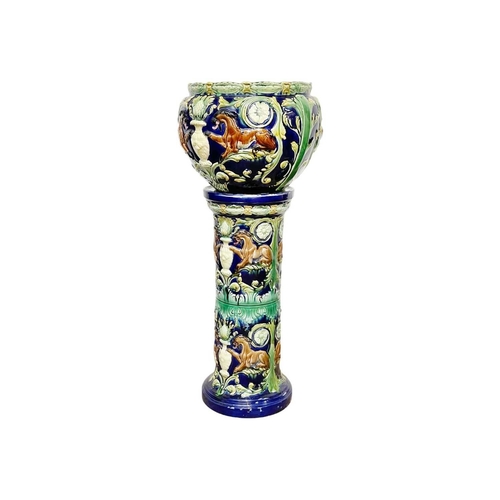 236 - A pair of continental majolica jardinieres and stands. Circa 1870, decorated with stylised beasts, f... 