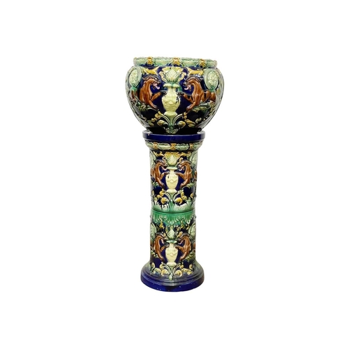 236 - A pair of continental majolica jardinieres and stands. Circa 1870, decorated with stylised beasts, f... 