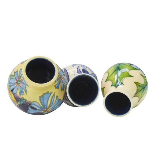 238 - Three Moorcroft vases in different forms. One 'Fly Away Home' vase, date stamp for 2006, height 21cm... 