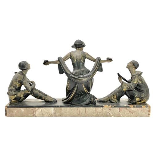 24 - A French Art Deco spelter Commedia dell'arte figure group. With a central Columbine being serenaded ... 