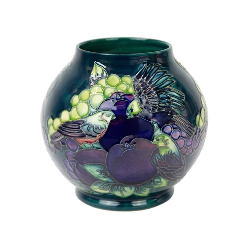 240 - A Moorcroft 'Finches' pattern vase. On teal ground, date stamped 1994, with impressed marks and pain... 