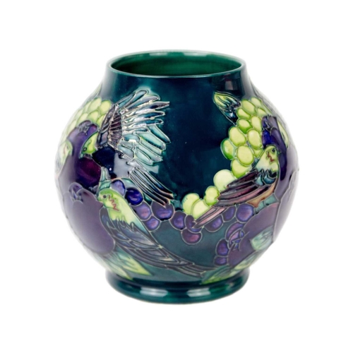 240 - A Moorcroft 'Finches' pattern vase. On teal ground, date stamped 1994, with impressed marks and pain... 