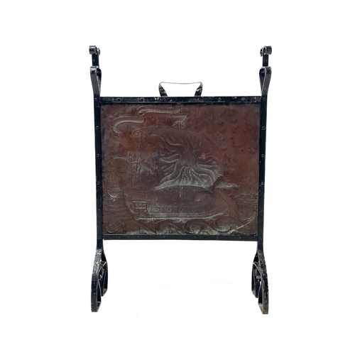 27 - An Arts and Crafts copper and wrought iron firescreen. Attributed to John Pearson, repousse decorate... 