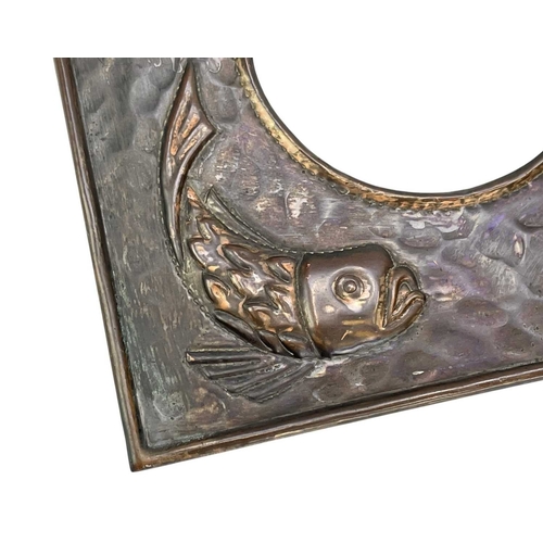 4 - A J & F Pool Hayle copper photograph frame. With a circular 9cm aperture, decorated with four fish, ... 