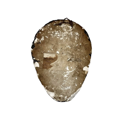 46 - A 20th century painted plaster wall mask. Inscribed 'Laughing Face F. Hill 19' on remnants of paper ... 