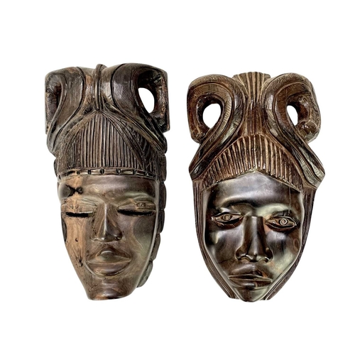 5 - Eight African carved hardwood masks. Length 40cm and smaller.