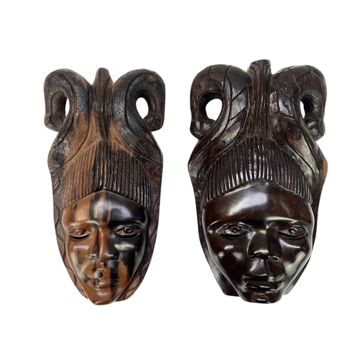 5 - Eight African carved hardwood masks. Length 40cm and smaller.