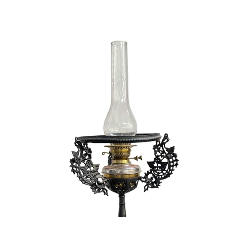 55 - A Victorian cast iron oil lamp stand. Height of stand 126cm, overall height 158cm.