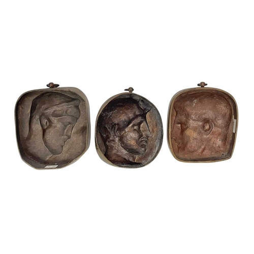 63 - Three 19th century French bronze wall plaques. Each cast with a profile portrait of a classical male... 