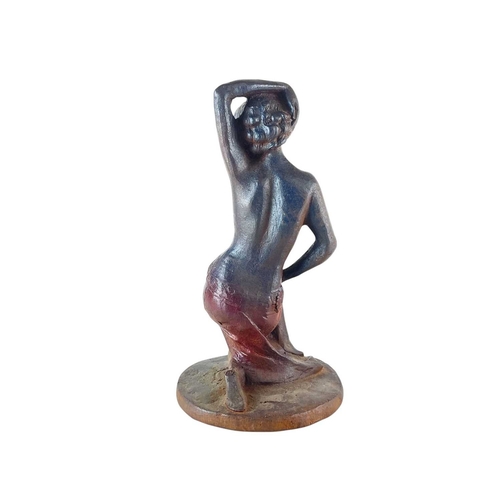 64 - An Art Deco style cast iron figure of an Egyptianesque female. Height 33cm.