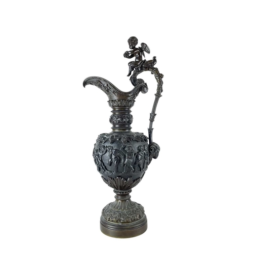 65 - A pair of substantial bronze side ewers. French, 19th century, the handles with cherub finials and r... 