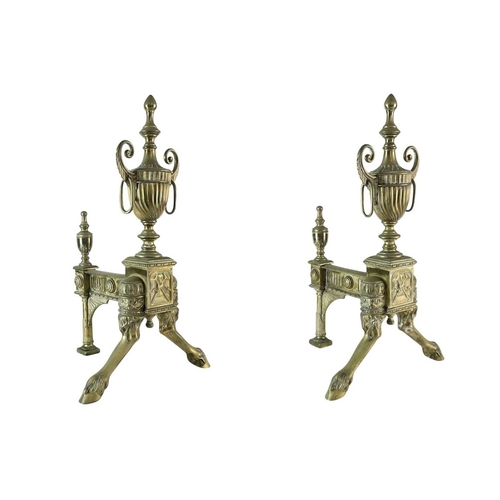 70 - A pair of ornate Neo-classical brass andirons. Early to mid 19th century, the urn finials with ring ... 