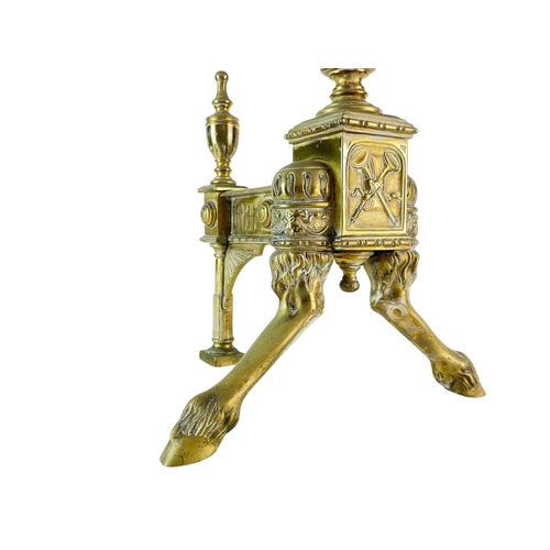 70 - A pair of ornate Neo-classical brass andirons. Early to mid 19th century, the urn finials with ring ... 