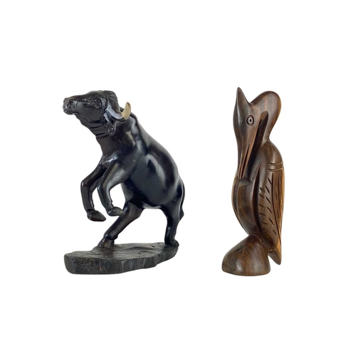 79 - Two pairs of African carved hardwood bookends. Featuring a male and female bust in each pair, with o... 