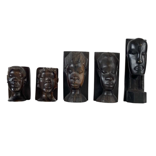 79 - Two pairs of African carved hardwood bookends. Featuring a male and female bust in each pair, with o... 