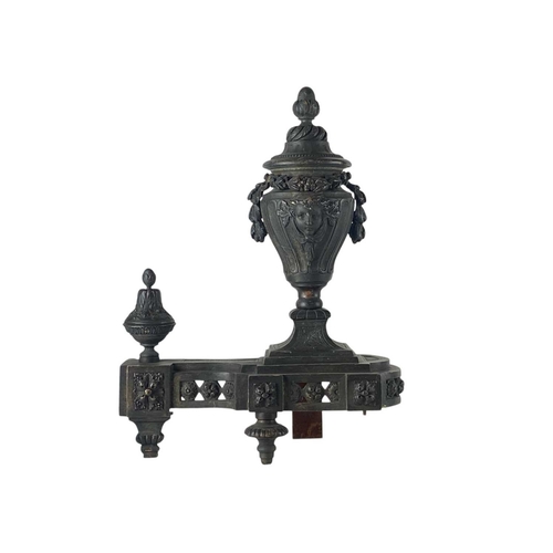 81 - A pair of French bronzed Chenet and fender rail. 19th century, with classical urn mounts and pierced... 