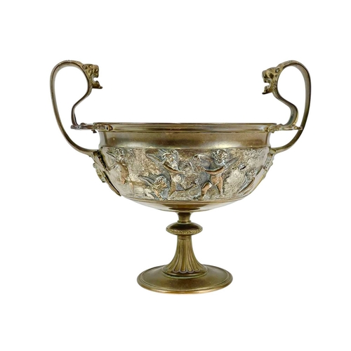 85 - A Ferdinand Barbedienne bronze tazza. France, 19th century, with twin lion mask mounted handles and ... 