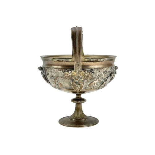 85 - A Ferdinand Barbedienne bronze tazza. France, 19th century, with twin lion mask mounted handles and ... 