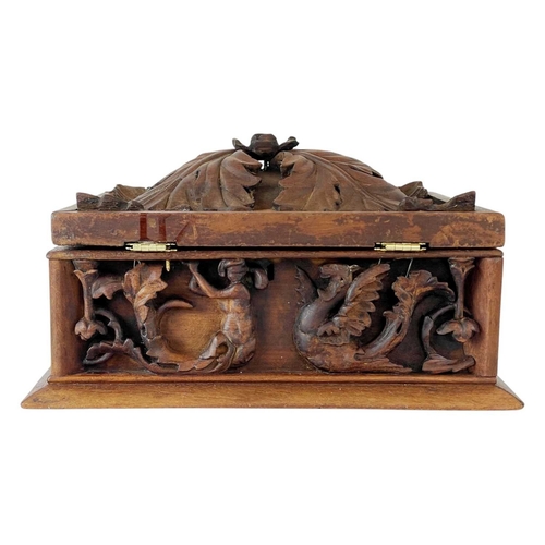 94 - An Eastern hardwood box. Carved with leafy scrolls, figures and beasts, height 20cm, width 36cm, dep... 