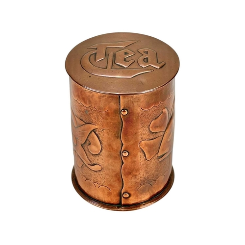 98 - A Newlyn cylindrical copper tea caddy Repousse decorated with two fish, on a matt ground, impressed ... 