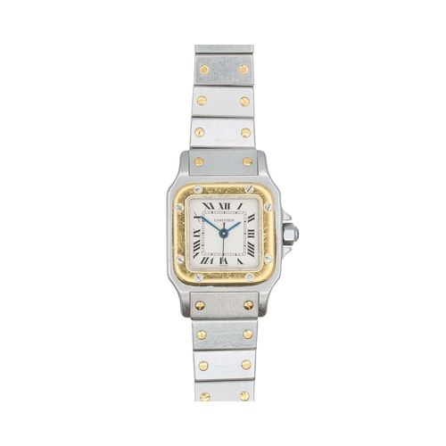 1051 - CARTIER - A Santos Carree stainless steel and gold lady's automatic bracelet wristwatch. The signed ... 