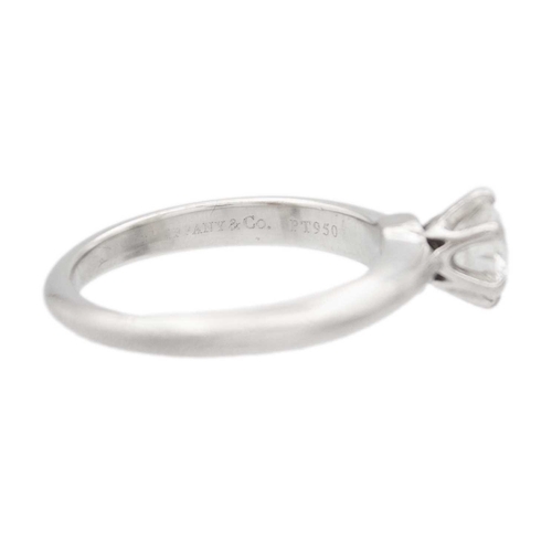 11 - TIFFANY & CO - A good platinum 0.59ct diamond solitaire ring with certificate and box. The six-claw ... 