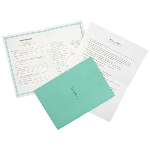 11 - TIFFANY & CO - A good platinum 0.59ct diamond solitaire ring with certificate and box. The six-claw ... 
