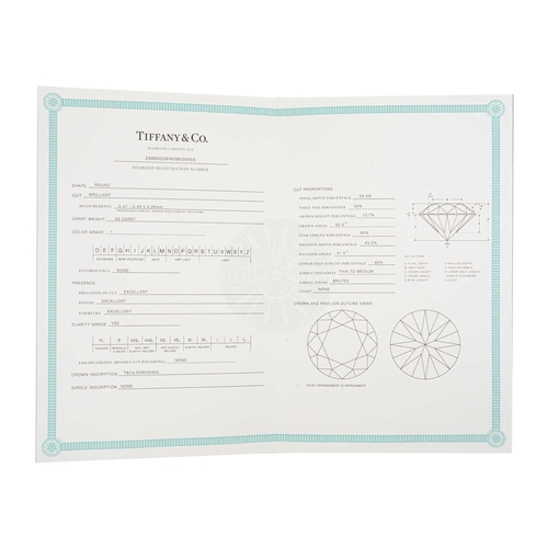 11 - TIFFANY & CO - A good platinum 0.59ct diamond solitaire ring with certificate and box. The six-claw ... 