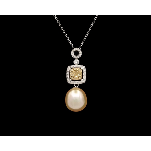 126 - An 18k gold pendant set with cultured golden pearl with yellow and white diamonds on a chain. The pe... 