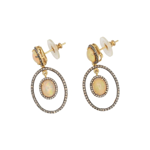 135 - A pair of silver gilt opal and diamond set pendant earrings. An opal cabochons are 9mm x 7mm each ap... 