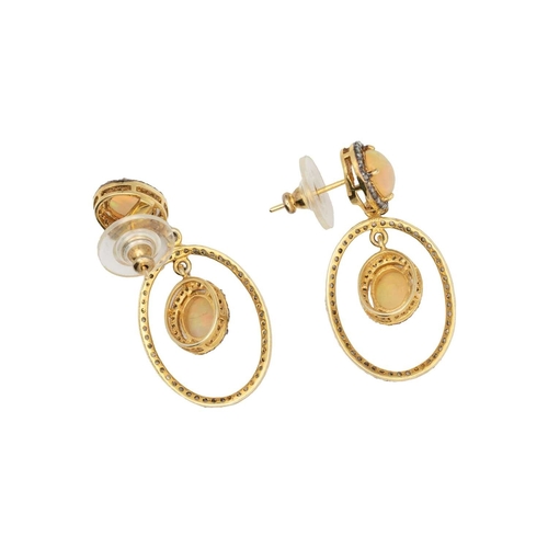 135 - A pair of silver gilt opal and diamond set pendant earrings. An opal cabochons are 9mm x 7mm each ap... 
