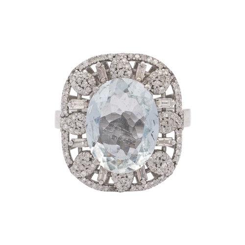 139 - An ornate silver aquamarine and diamonds set dress ring. The ring head is 2.2cm x 1.8cm, stamped 925... 