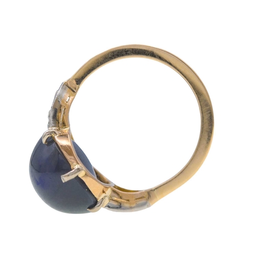 14 - A good Art Deco black opal and diamond set gold and platinum dress ring. The large cabochon opal wit... 