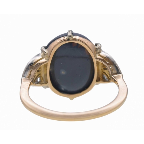 14 - A good Art Deco black opal and diamond set gold and platinum dress ring. The large cabochon opal wit... 