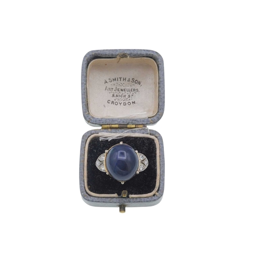 14 - A good Art Deco black opal and diamond set gold and platinum dress ring. The large cabochon opal wit... 